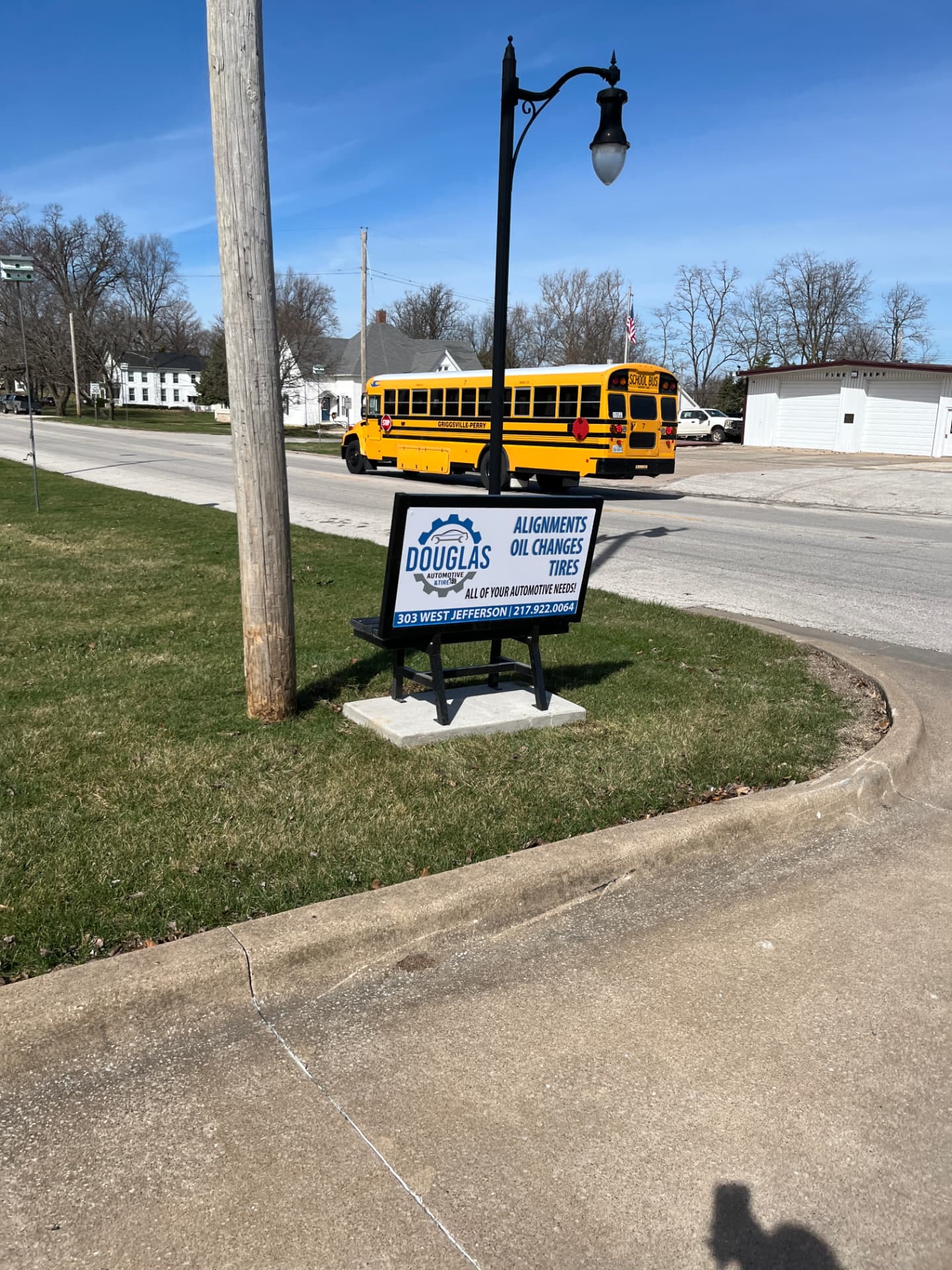 Douglas Automotive Benchboard with a school bus passing behind it